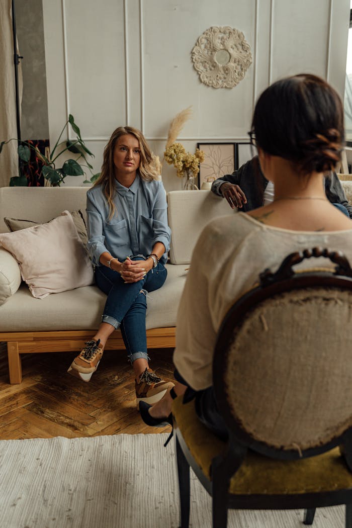 about-01 A therapist and client in discussion during a cozy indoor session highlighting mental health.